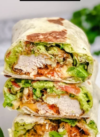 Delicious crispy chicken wrap with fresh vegetables and savory sauce