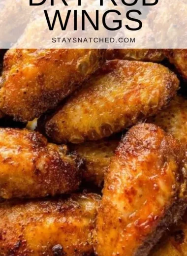 Delicious dry rub chicken wings served on a platter with dipping sauce