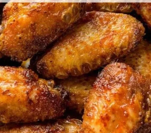 Delicious dry rub chicken wings served on a platter with dipping sauce