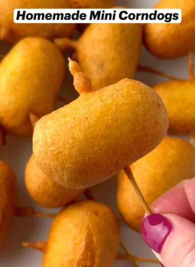 Plate of homemade mini corndogs with dipping sauce