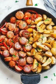 Delicious smoked sausage and potato skillet dish served in a cast iron pan.