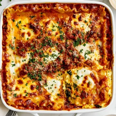 Baked Cottage Cheese Lasagna topped with mozzarella and fresh herbs
