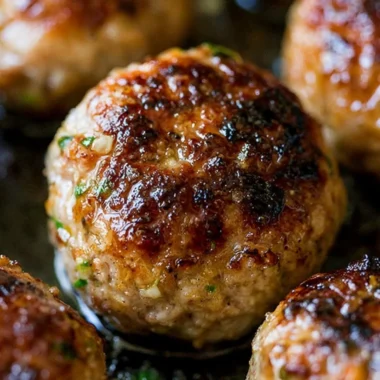 Delicious cozy meatball recipe served with fresh herbs and sauce