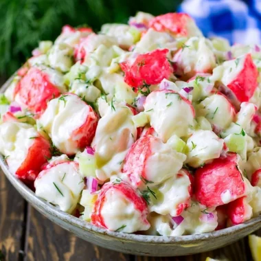 Delicious homemade crab salad served in a bowl with fresh ingredients.
