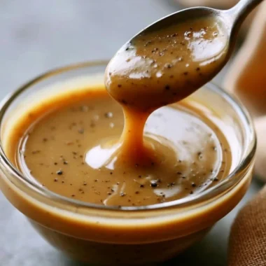 Creamy balsamic vinaigrette drizzled over a fresh salad