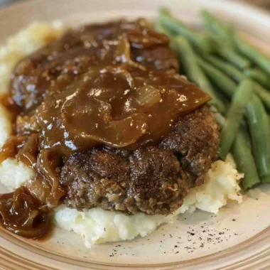 Delicious easy Salisbury steak served with gravy and mashed potatoes