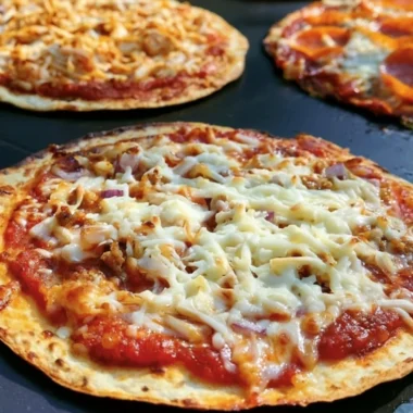 Homemade Blackstone griddle pizza with fresh toppings and crispy crust