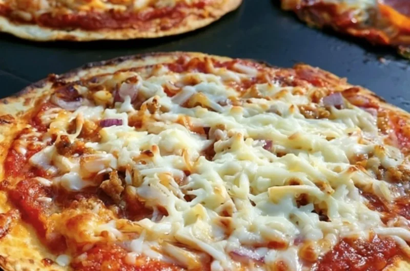 Homemade Blackstone griddle pizza with fresh toppings and crispy crust