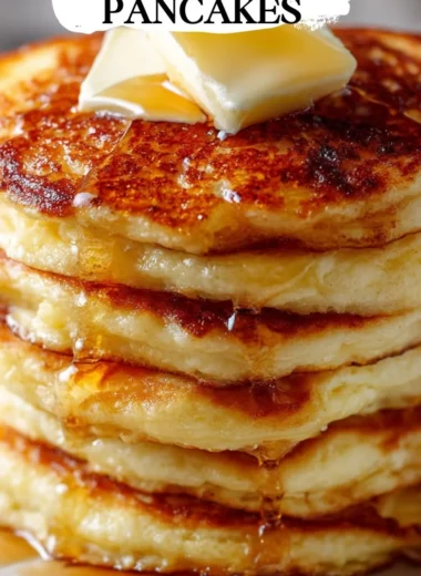 Stack of old-fashioned pancakes served with syrup and butter