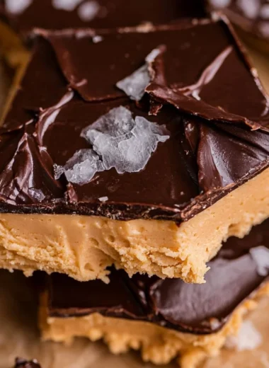 Peanut Butter Chocolate Greek Yogurt Bark topped with nuts and chocolate.