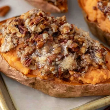 Pecan Pie Twice Baked Sweet Potatoes served on a festive plate