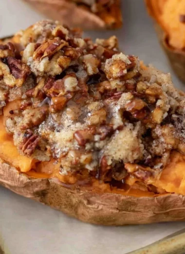 Pecan Pie Twice Baked Sweet Potatoes served on a festive plate