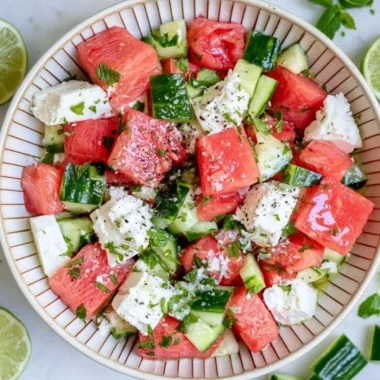 Fresh watermelon cucumber salad with feta cheese served in a bowl