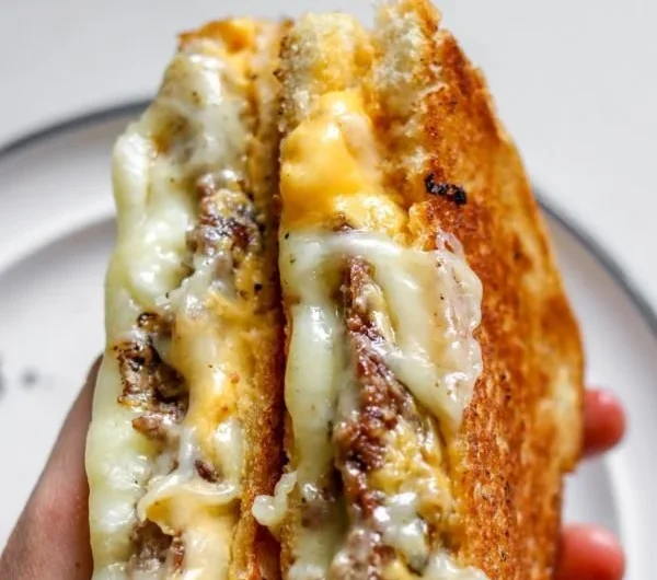 Delicious Smashburger Grilled Cheese sandwich with golden, melted cheese