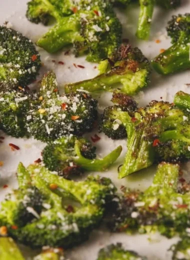 Smashed Broccoli dish showcasing vibrant green florets and a gourmet presentation.