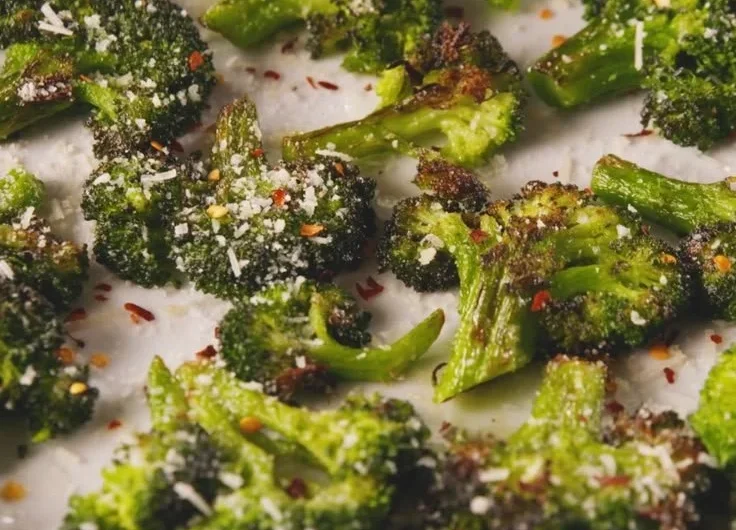 Smashed Broccoli dish showcasing vibrant green florets and a gourmet presentation.