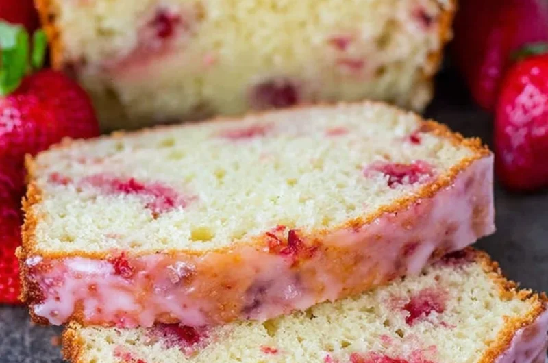 Delicious homemade strawberry pound cake slice on a plate with fresh strawberries