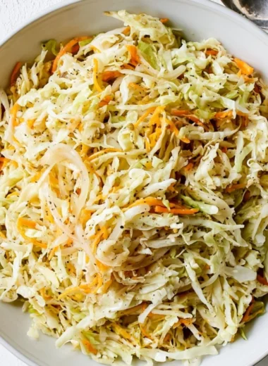 Bowl of fresh vinegar coleslaw with colorful cabbage and carrots