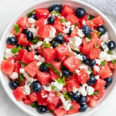 Delicious watermelon feta salad with fresh herbs and toppings