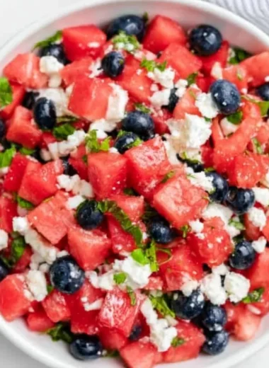 Delicious watermelon feta salad with fresh herbs and toppings