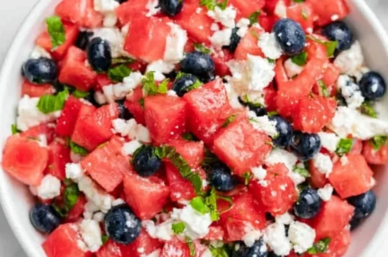 Delicious watermelon feta salad with fresh herbs and toppings