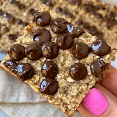 Delicious banana bread oatmeal bars topped with nuts and chocolate chips.