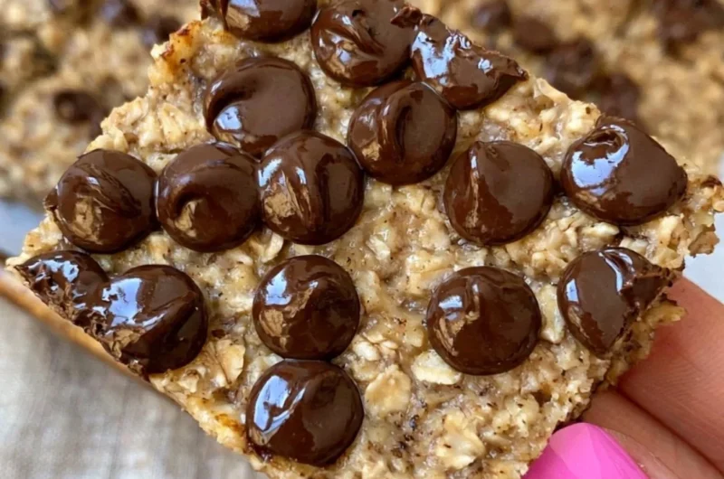 Delicious banana bread oatmeal bars topped with nuts and chocolate chips.