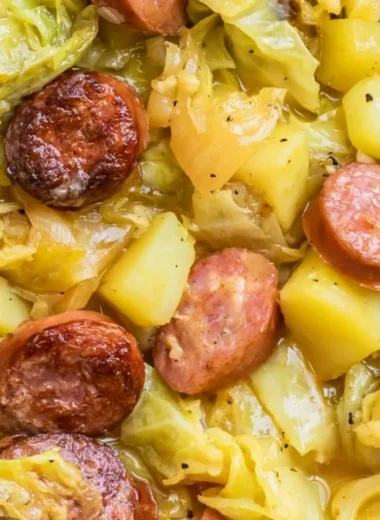 Hearty bowl of cabbage potatoes and sausage meal