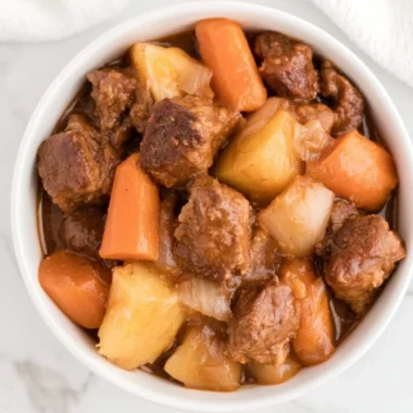 Cozy crockpot beef stew with vegetables and tender beef simmering in broth
