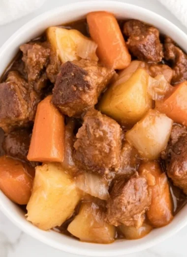 Cozy crockpot beef stew with vegetables and tender beef simmering in broth