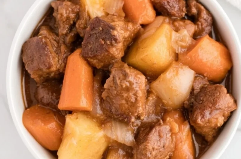 Cozy crockpot beef stew with vegetables and tender beef simmering in broth
