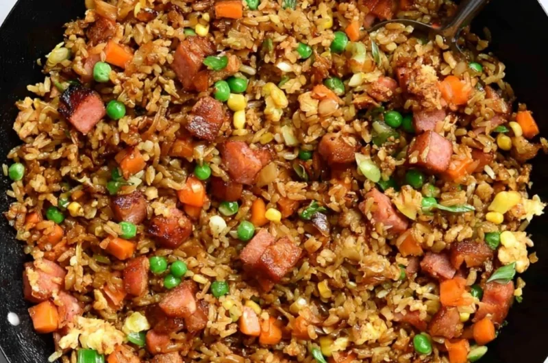 A bowl of cozy delicious Spam Fried Rice garnished with green onions.