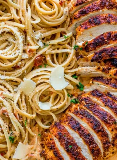 Delicious creamy Cajun chicken pasta served in a bowl with herbs