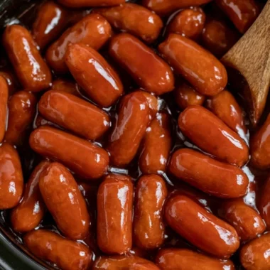 Delicious Crockpot BBQ Little Smokies simmering in a sauce