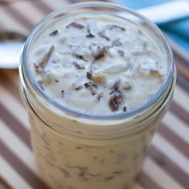 Bowl of homemade condensed cream of mushroom soup with fresh ingredients
