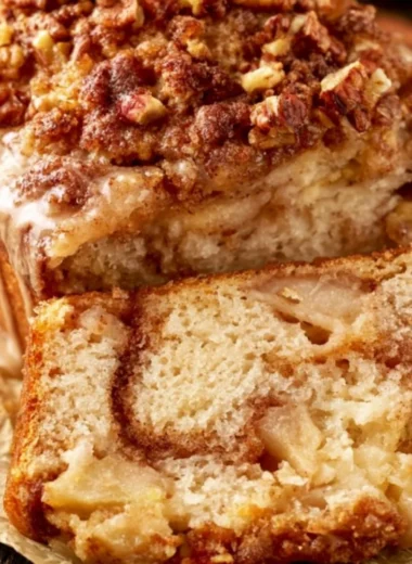 Moist and tender cinnamon apple bread loaf with cinnamon and apples.