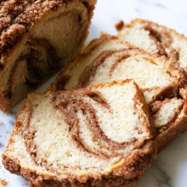 Cozy cinnamon swirl vanilla pound cake fresh from the oven with a golden crust.