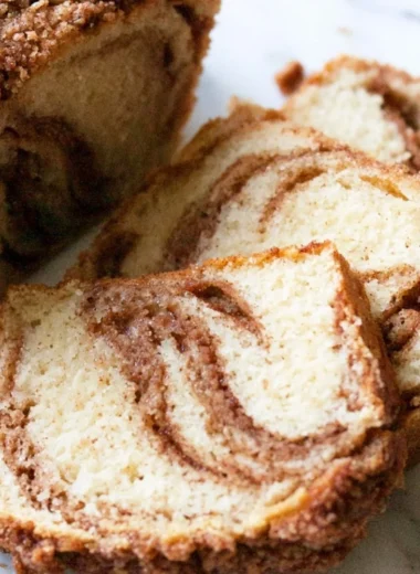 Cozy cinnamon swirl vanilla pound cake fresh from the oven with a golden crust.