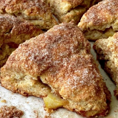 Cozy apple scones freshly baked and served on a wooden table