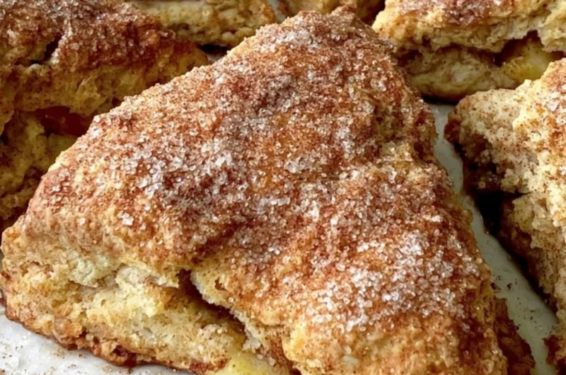 Cozy apple scones freshly baked and served on a wooden table