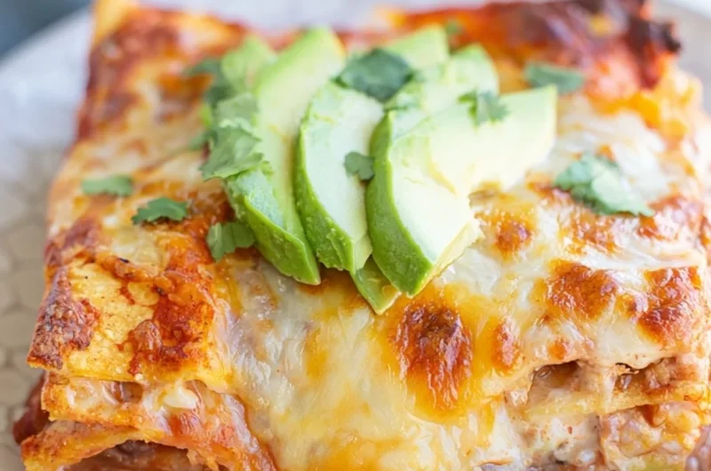 Cozy bean and cheese enchilada casserole topped with melted cheese