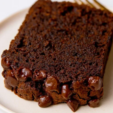 Slice of double chocolate pumpkin bread with chocolate chips and pumpkin