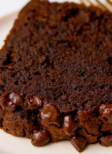 Slice of double chocolate pumpkin bread with chocolate chips and pumpkin
