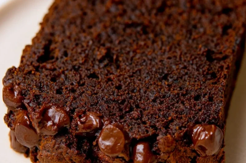 Slice of double chocolate pumpkin bread with chocolate chips and pumpkin