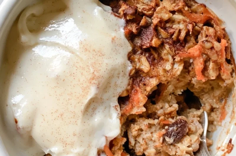 Delicious carrot cake baked oatmeal served in a bowl with frosting