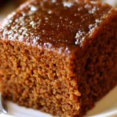 Delicious easy gingerbread cake topped with cream frosting and spices