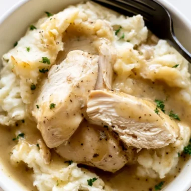 Delicious Instant Pot Chicken and Gravy served with mashed potatoes