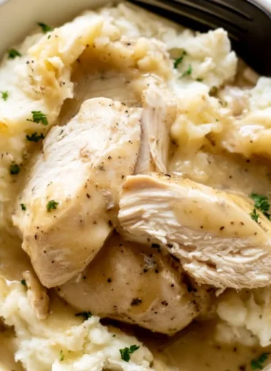Delicious Instant Pot Chicken and Gravy served with mashed potatoes